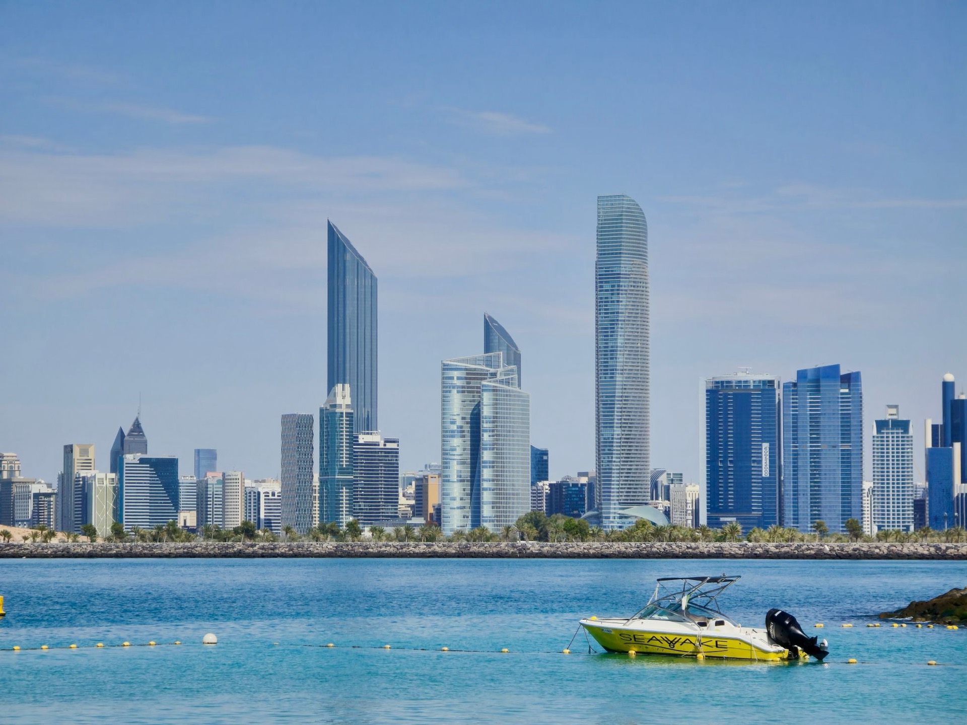 Turquoise Gulf water in front of the Abu Dhabi skyline
