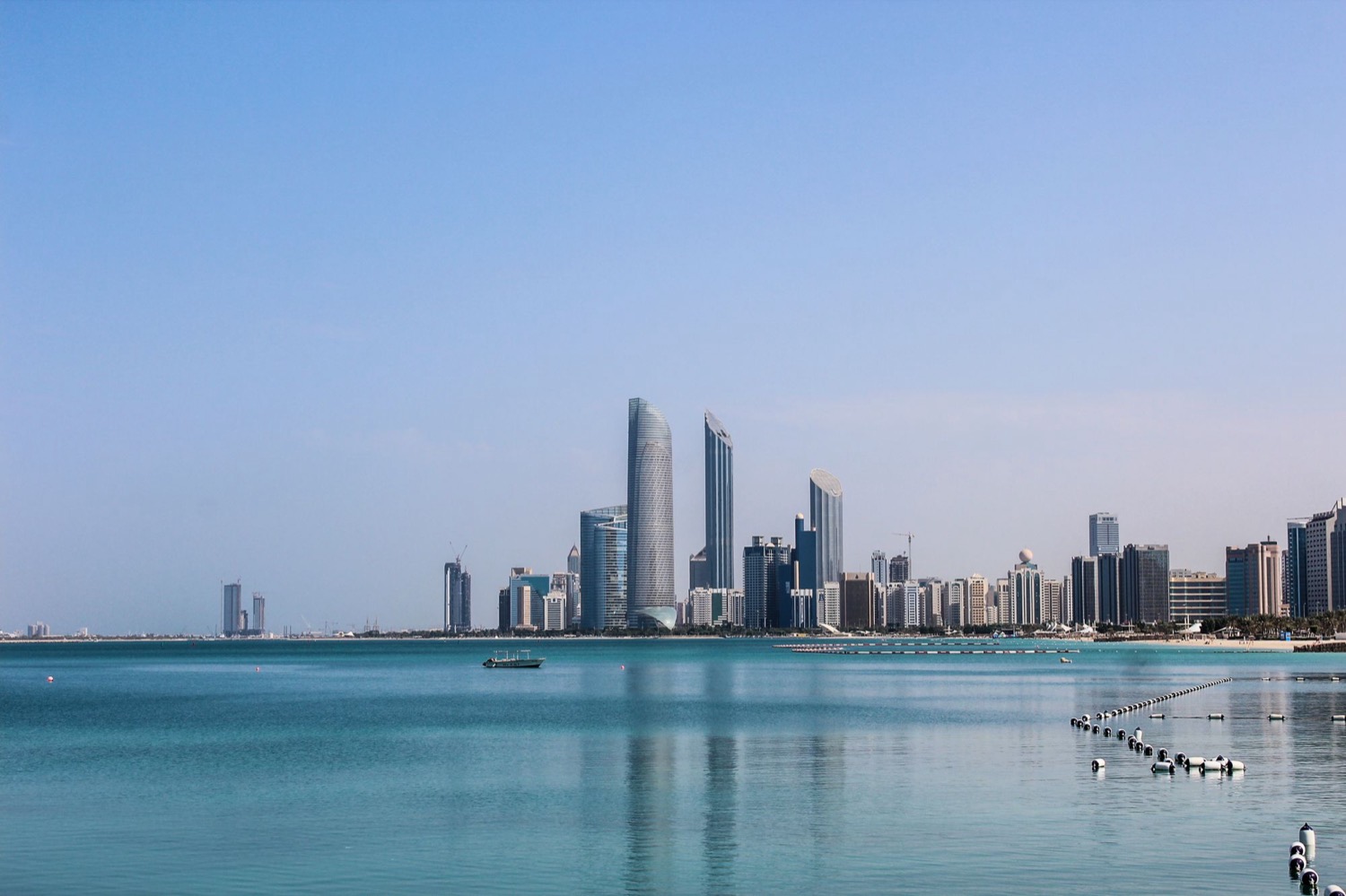 The Abu Dhabi Corniche skyline across calm Gulf water