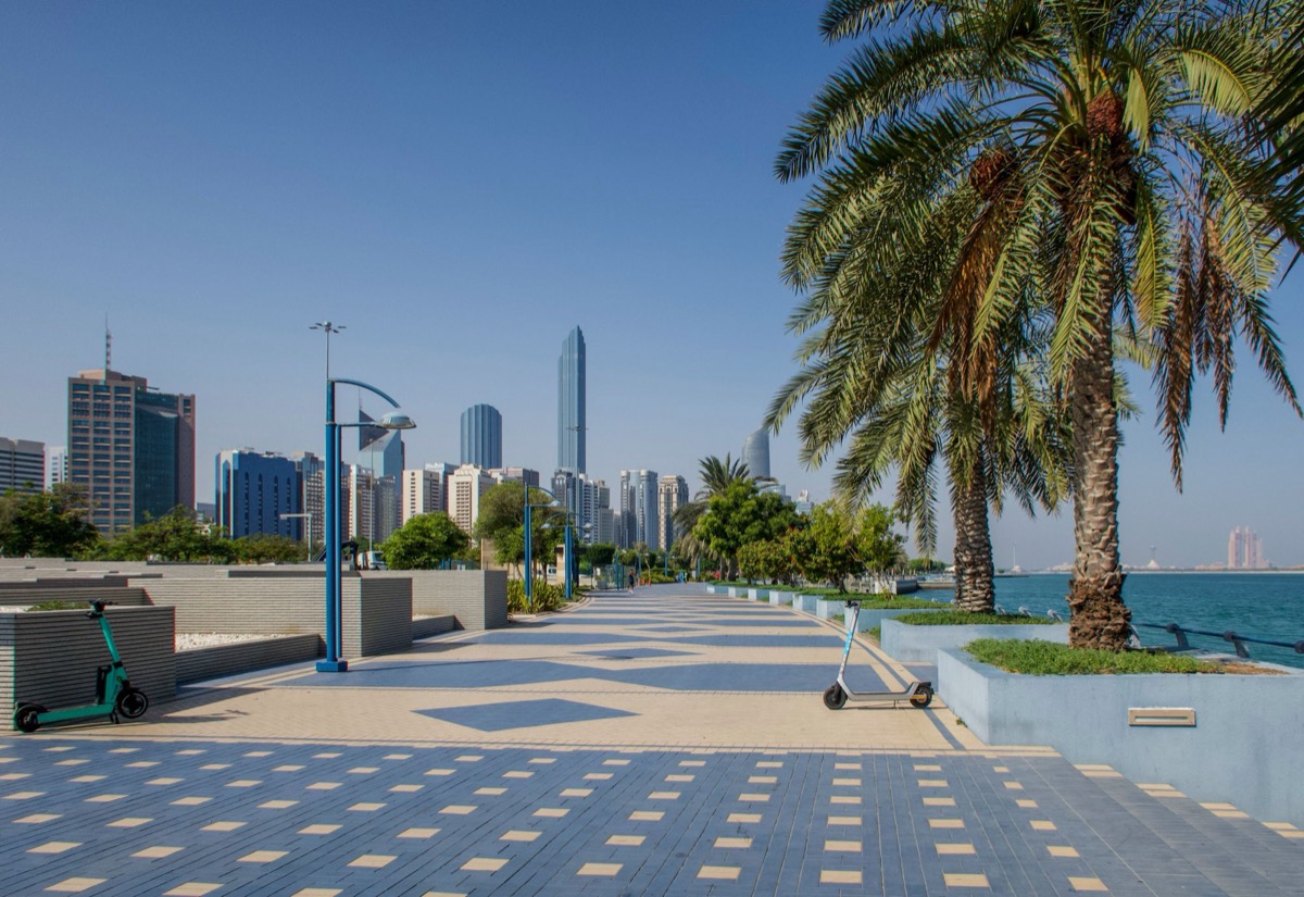 Palm-lined waterfront promenade along the Abu Dhabi Corniche